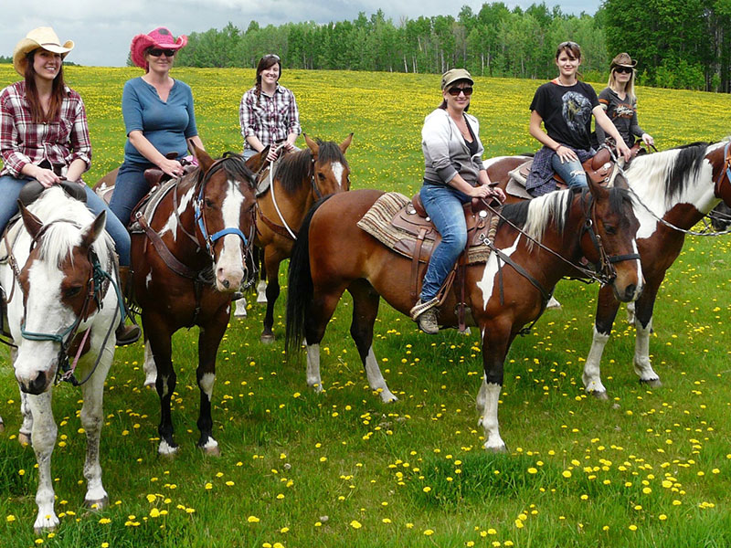 classic cowgirl wellness retreats cowgirls riding field